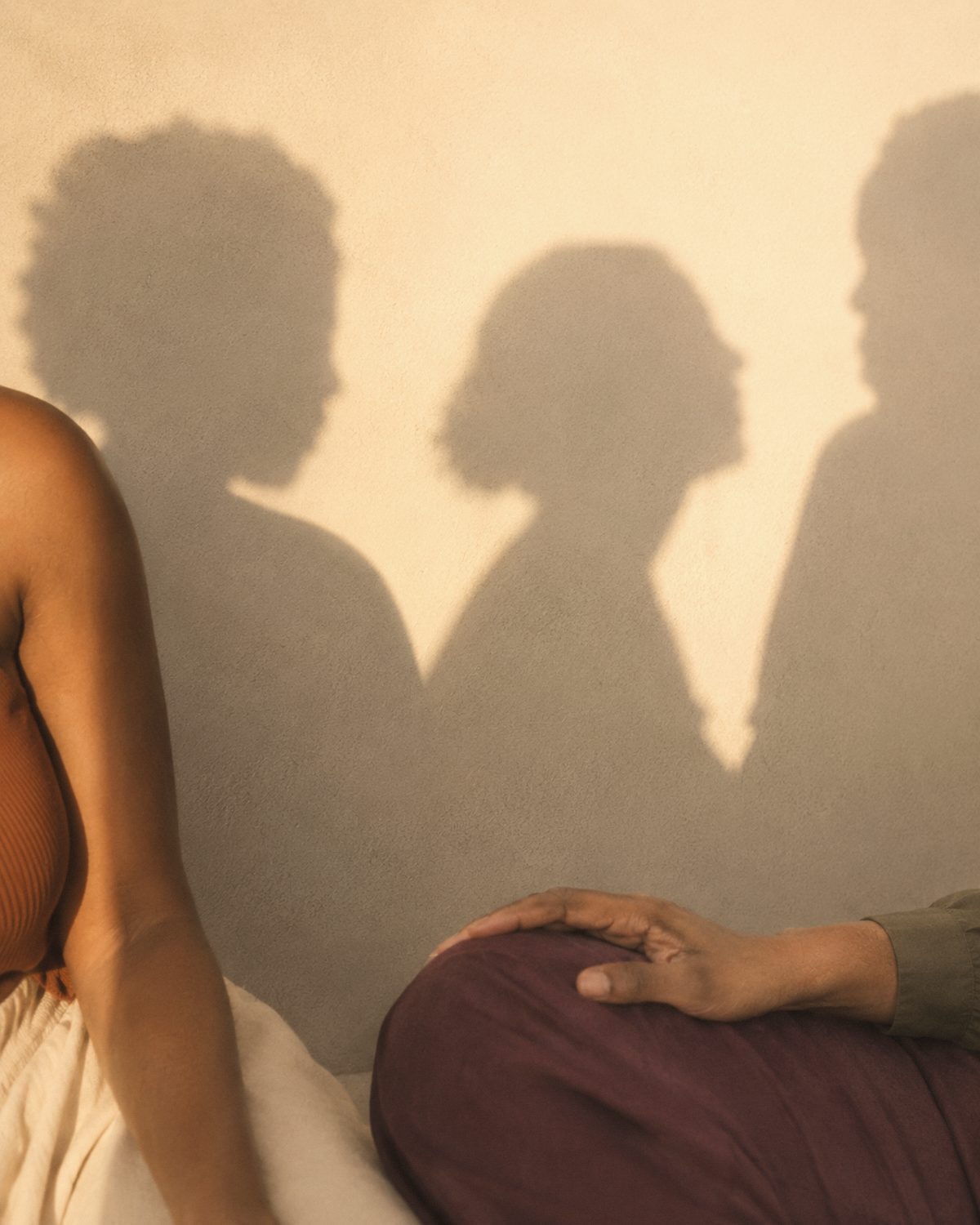 Two figures in warm light